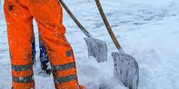 Workers shoveling snow