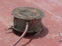 Figure 15: Corpus blower with proper guards and grounded with alligator clip ventilating fuel tank.