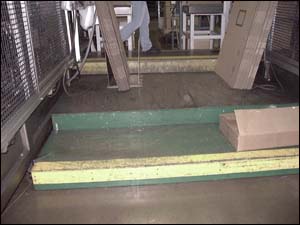 Figure 22. Open platforms that are built up in between thermoformers to get personnel up to a proper work height.