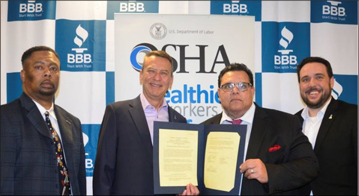 OSHA's Officers & Better Business Bureau President pose for pic after partnership signing