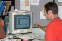 Figure 1. Poor mouse and keyboard placement because of desktop clutter