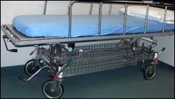 Gurney with appropriate mechanisms for control and braking.
