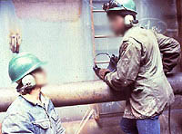 Figure 18: Workers wearing ear muffs for protection from excessive noise.