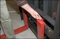 Figure 5. Operator inspecting the top clip retaining pin for the forks.