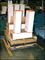 Figure 33. Notice multiple pallets to elevate signatures. Care must be taken to limit the height of signature piles to about shoulder height.