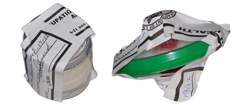 Figure E-4. Correctly sealed cassette with Form OSHA-21 covering inlet/outlet ports maintaining sample integrity.